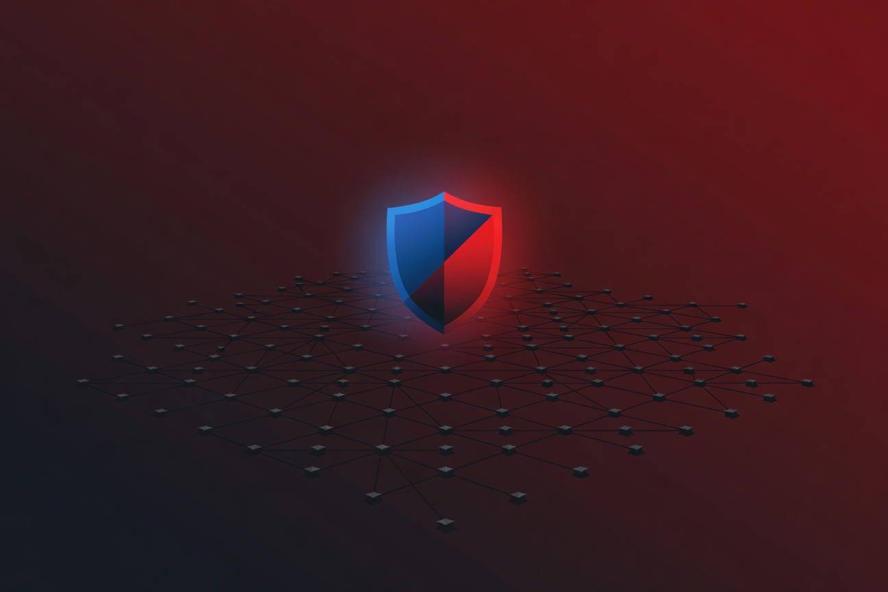 A glowing shield emblem split diagonally in blue and red, floating above a dark grid of interconnected nodes